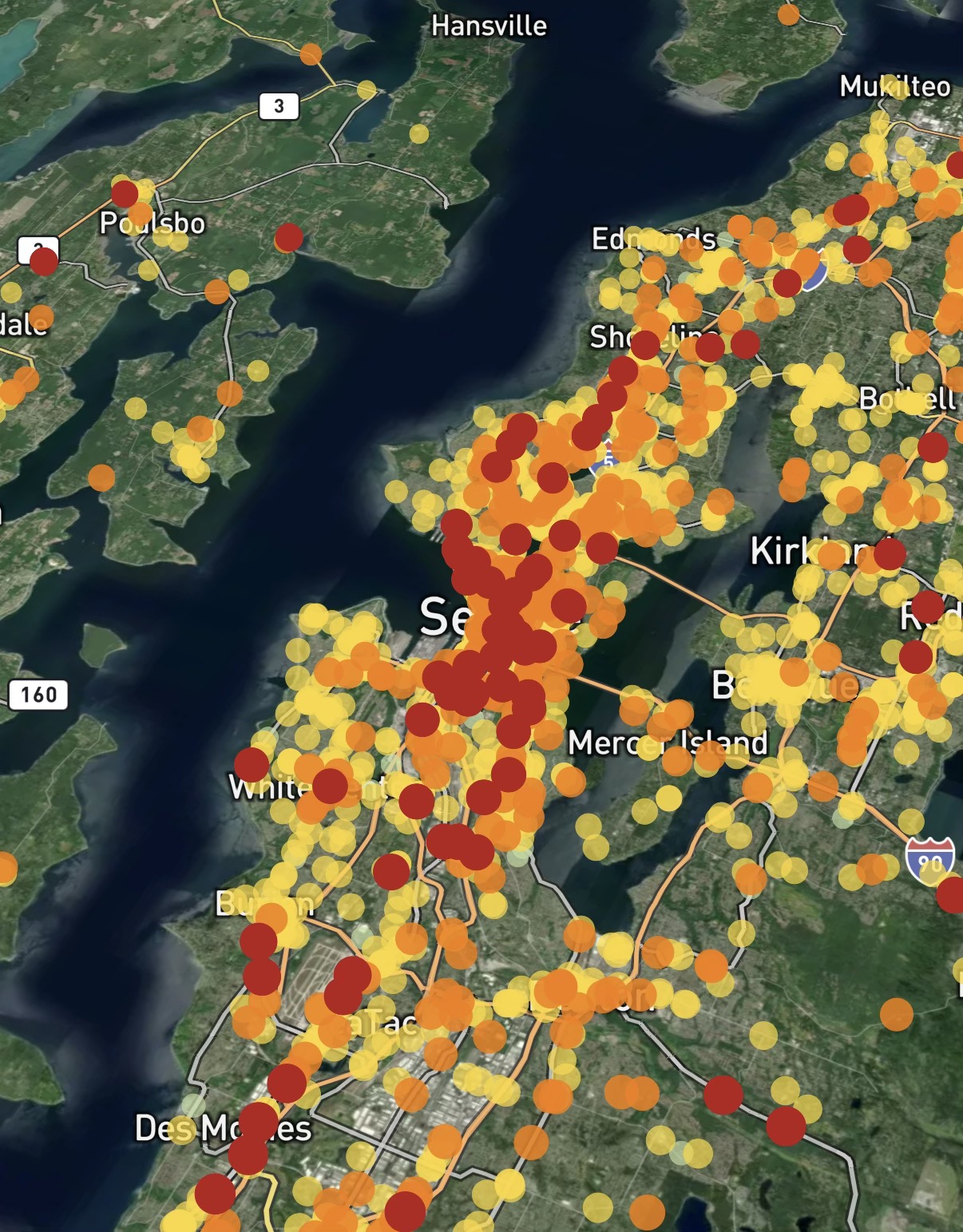 A map of Seattle showing many red, orange and yellow dots representing crashes
